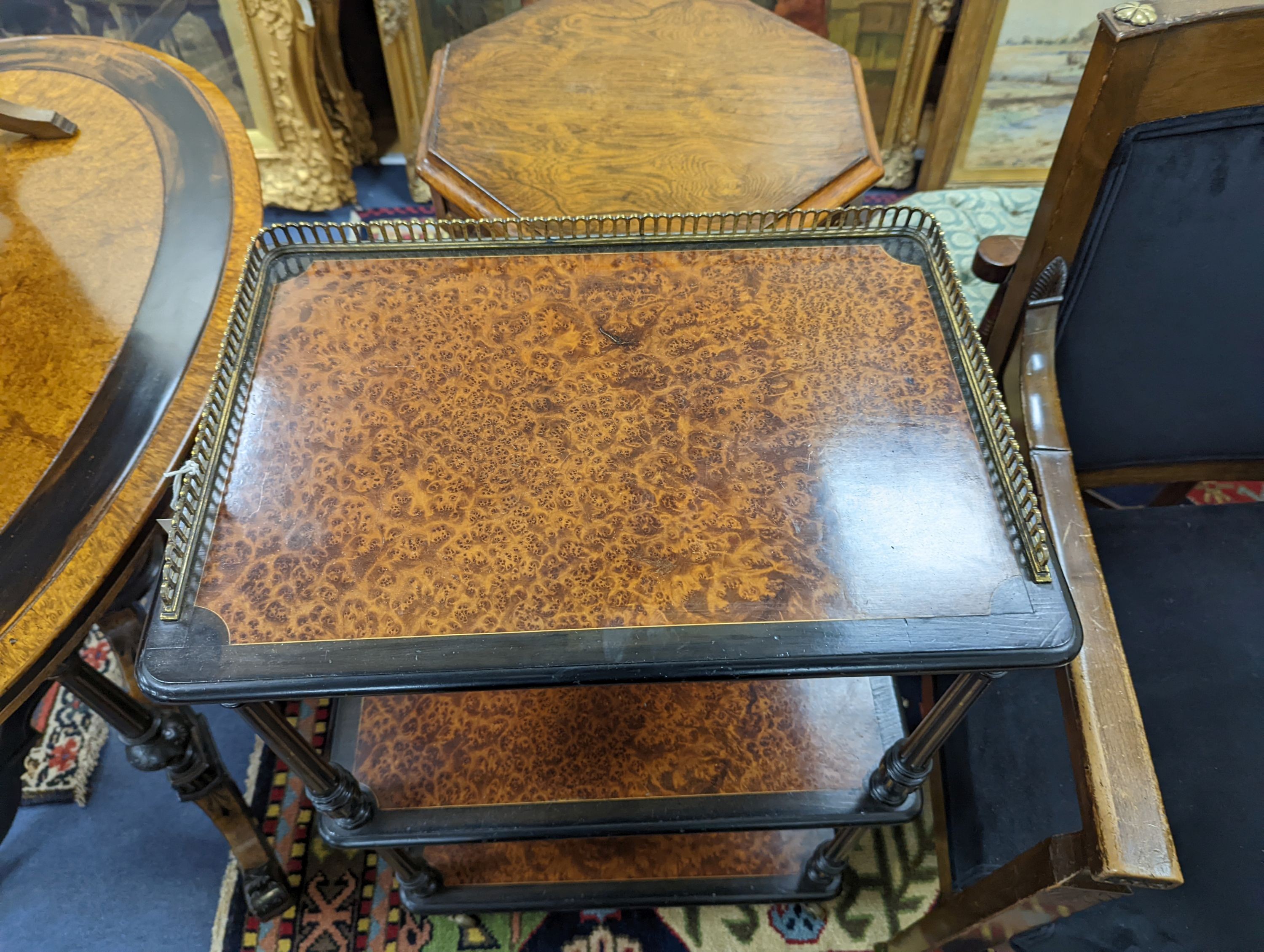 A late Victorian part ebonised Amboyna three tier whatnot with brass galleried top, width 49cm, depth 33cm, height 83cm